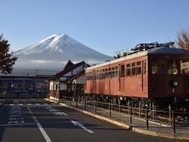 Train departing Osaka Station with Mount Fuji visible in distance, representing day trip possibilities. Image by Frank Chang from Pixabay