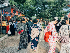 Summer festival in local neighborhood with traditional performances and food stalls.Photo by note thanun on Unsplash