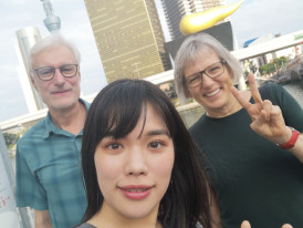 Host and guests posing for a photo with Tokyo Skytree.