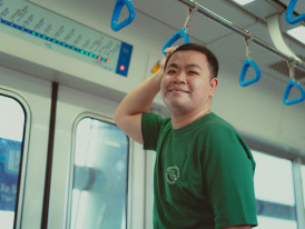 Smiling traveler boarding a Kyoto-bound train Photo by Khanh Nguyen on Unsplash