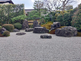 A peaceful temple garden with raked gravel and carefully placed stones Photo by Caroline Herman on Unsplash