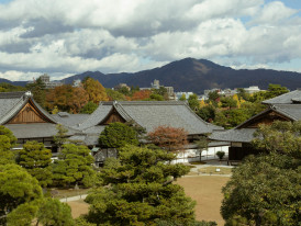 Modern Kyoto cityscape viewed from ancient temple grounds showing blend of old and new Photo by Charlie Charoenwattana on Unspla