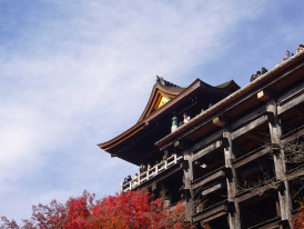 Traditional temple architecture silhouetted against autumn sky Photo by Syadza Salsabyla on Unsplash