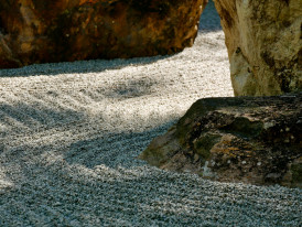 Close-up of a raked rock garden Photo by Rafael Figueroa on Unsplash