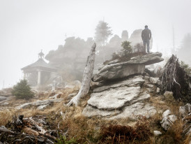 A misty mountain temple with moss-covered stones and ancient trees creating a mystical atmosphere Photo by Sebastian Pichler on Unsplash
