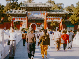 Early morning visitors walking peacefully through traditional temple grounds with soft golden light Photo by Annie Spratt on Unsplash
