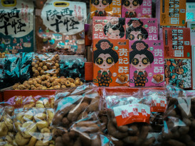 Colorful traditional sweets displayed in market stall Photo by Sergio Kian on Unsplash