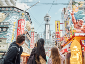Tsutenkaku Tower rising above Shinsekai's retro streetscape.