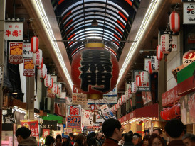 Crowded Shinsaibashi shopping arcade with overhead decorations Daniel Pelaez Duque on Unsplash