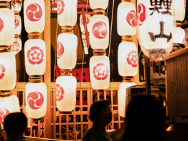 Lighting Paper Lanterns at Night in Kyoto