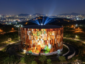 The glowing, transformed Oil Tank Culture Park at night, with its industrial structures and peaceful ambiance (P)