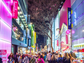 Late-night shopping scene in Seoul, with stores and eateries staying open past midnight