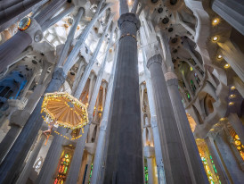 Interior columns and stained glass colors inside a basilica