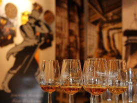 Irish whiskey tasting glasses on a wooden bar in Dublin