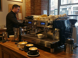Specialty coffee cups and espresso machine in a Dublin café