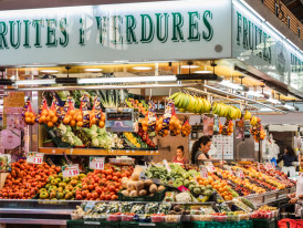 People browsing through local goods at a market