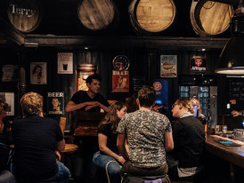 Cozy brown cafe interior during winter with locals warming up
