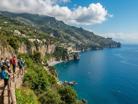 Hikers on a coastal trail above Sorrento with Amalfi Coast cliffs