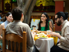 Local family sharing a meal at a neighborhood restaurant