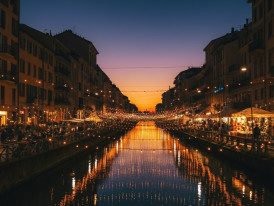 Evening lights reflecting on Navigli canals in Milan