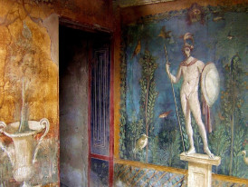 Frescoed room in Oplontis with vivid reds, greens and yellows