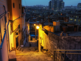 Quiet alley in Haebangchon with warm lighting 