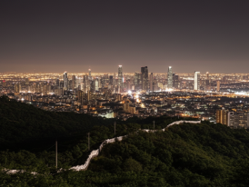 Scenic night view from Inwangsan mountain showing Seoul's fortress wall and city lights below
