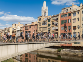 Girona Onyar river with pastel houses and pedestrian bridge