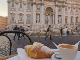  Morning espresso in a Roman café and visitors enjouing and rushing past the Trevi Fountain