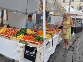 Bracciano market stall stacked with fruit and veg and cheese