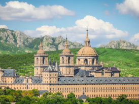 El Escorial’s grand architecture framed by the serene mountains of Madrid