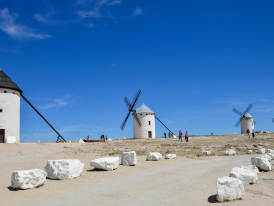 The famous Don Quixote windmills of Consuegra against a vast sky