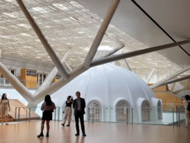 Visitors beneath the glass roof at the National Gallery Singapore