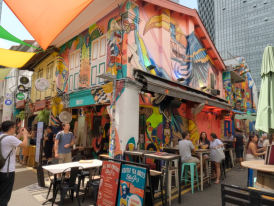 Colorful shopfronts along Haji Lane with cafes and street art