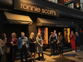 Ronnie Scott’s Jazz Club neon marquee glowing in Soho