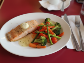 Flame-seared salmon with seasonal vegetables
