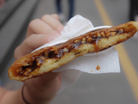 Steaming hotteok with brown sugar syrup oozing