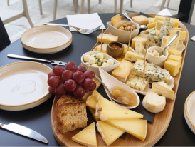 A traditional French cheese plate with Brie, Roquefort, and other varieties