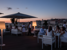 Hotel Mundial rooftop bar with cocktails and city view at dusk