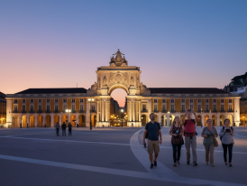 Praça do Comércio arch illuminated at night with empty square and river