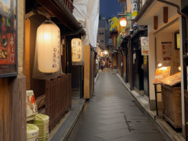 Narrow Ponto-chō alley at night with glowing lanterns