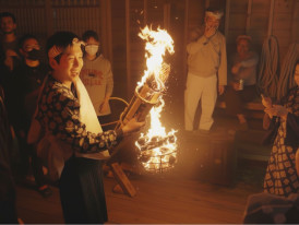 Carrying giant flaming torches through the streets of Kurama fire festival