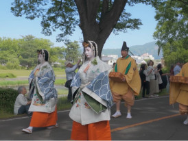 Silk-robed procession moving slowly during Aoi Matsuri in Kyoto