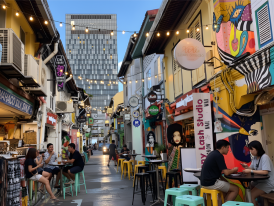 Colorful Haji Lane alley with street art and small bar entrances glowing