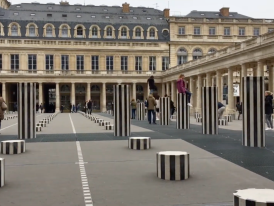 Striped columns and peaceful garden inside Palais Royal courtyard