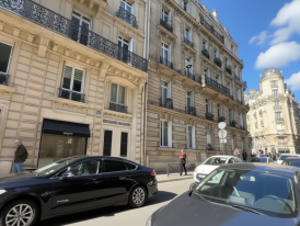 Typical Paris apartment building entrance with ornate iron door