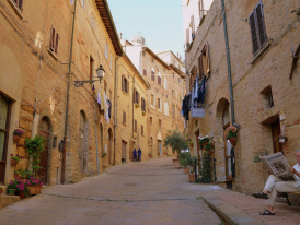 Quiet medieval street in Volterra with old stone buildings