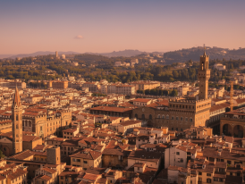 Evening light illuminating Florence's terracotta rooftops from above