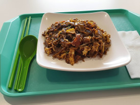 Dark soy-glazed flat noodles with bean sprouts
