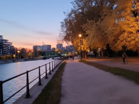 Lachine Canal at dusk with cyclists and walkers on the path